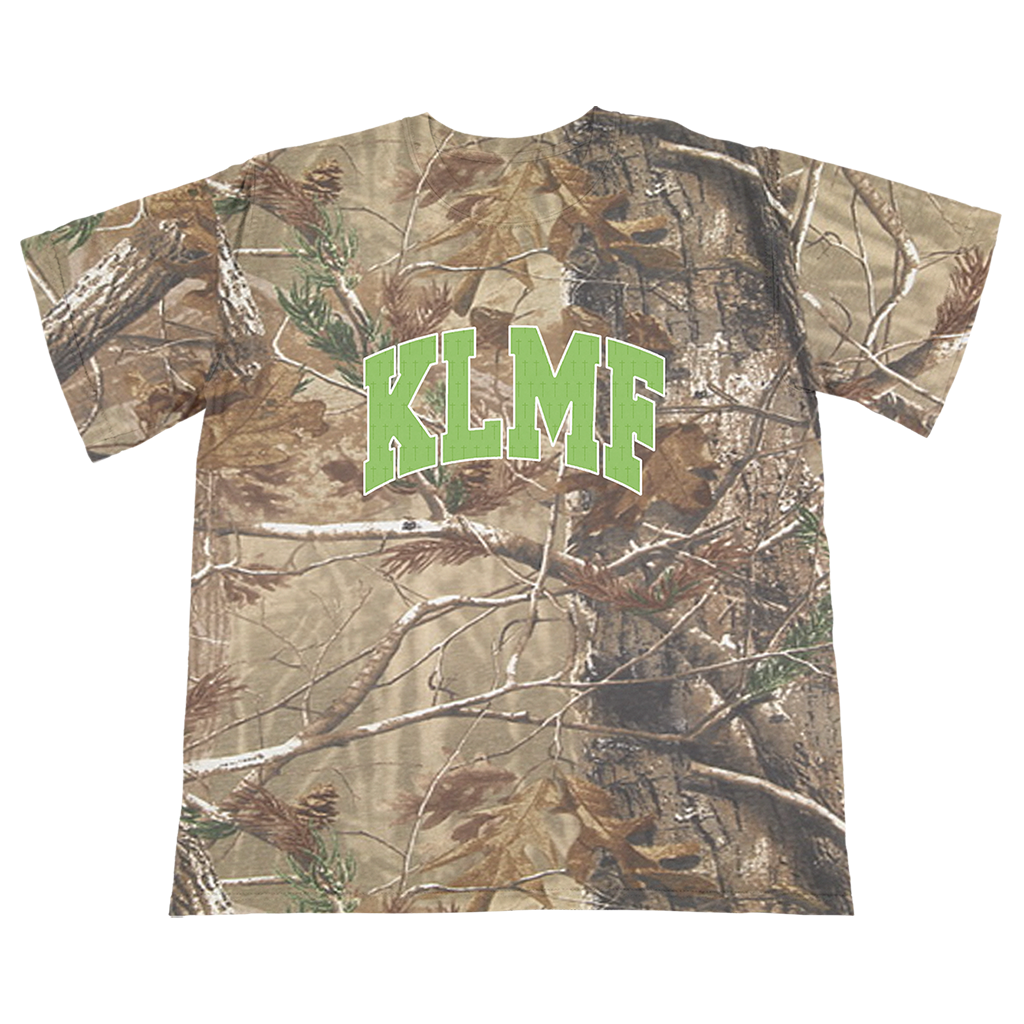 Knocked Loose's "Cross Overlay KLMF" design, printed on the front and upper back of a Real Tree Camo Tee.