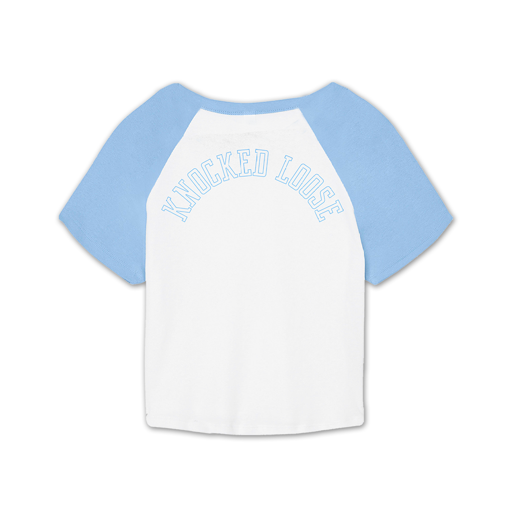 Knocked Loose's "KLMF Cross Overlay" design, printed on the front and back of a white and baby blue color Bella and Canvas raglan crop top.