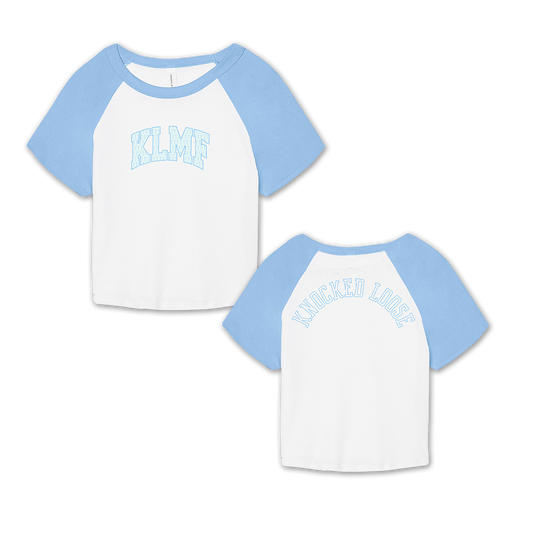 Knocked Loose's "KLMF Cross Overlay" design, printed on the front and back of a white and baby blue color Bella and Canvas raglan crop top.