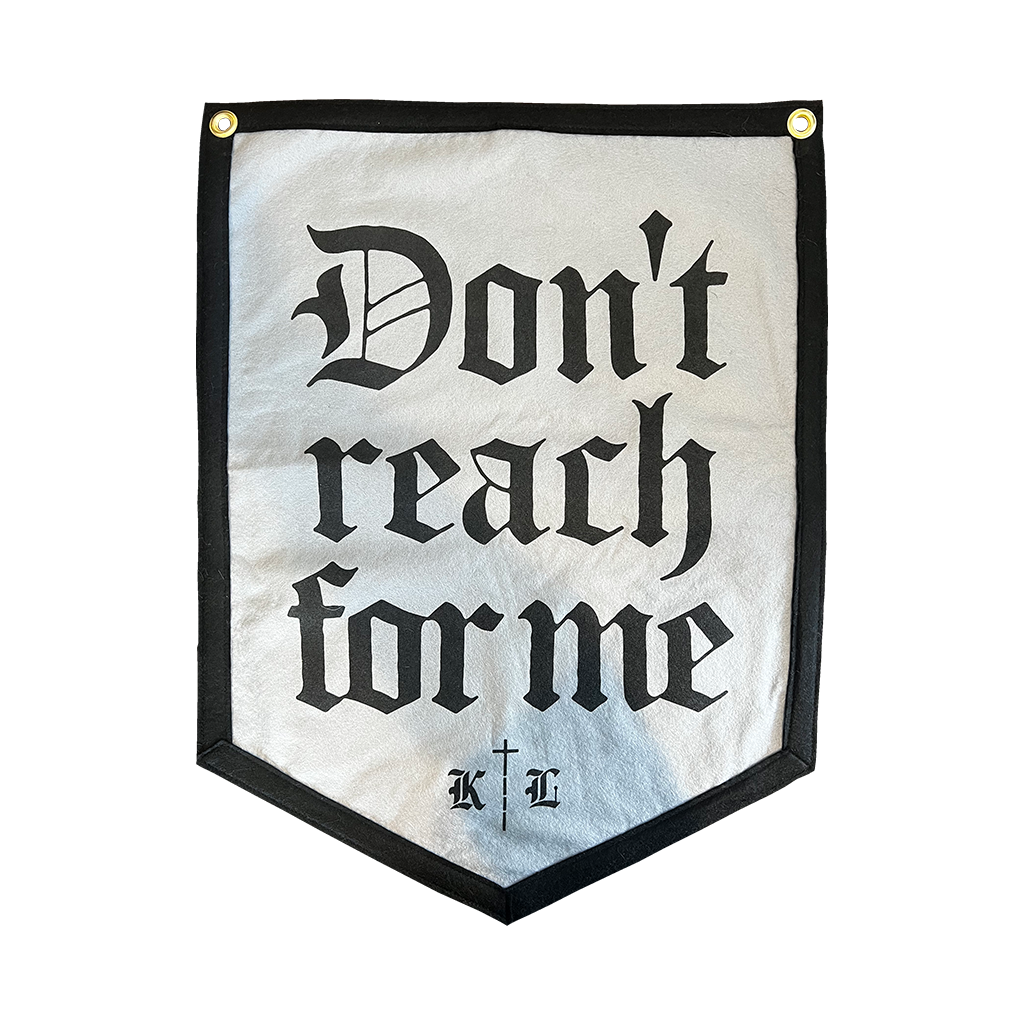 Knocked Loose's "Don't Reach For Me" design, custom printed on the front of a 18" X 24" grey 5 sided hanging camp flag.